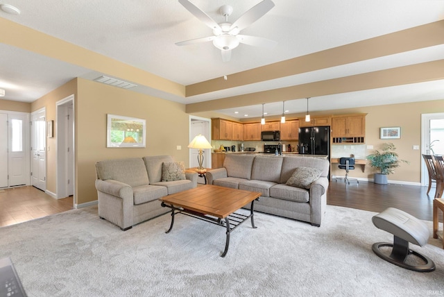 10057 Chapmans Cv, Fort Wayne, IN 46835 - living area with ceiling fan and wood finished floors