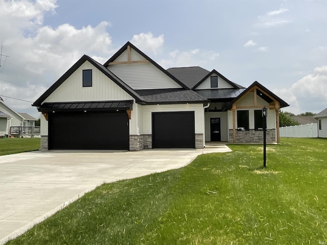 1609 Diane Dr, Ossian, IN 46777 - view of front of property with stone siding, a standing seam roof, an attached garage, driveway, and a metal roof