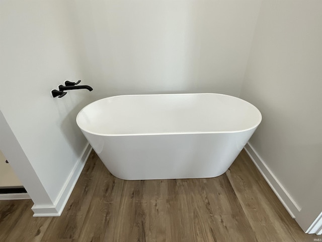 1609 Diane Dr, Ossian, IN 46777 - full bathroom with wood finished floors and a soaking tub