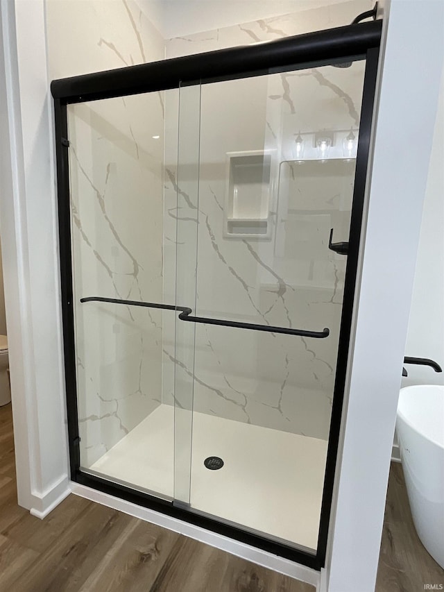 1609 Diane Dr, Ossian, IN 46777 - bathroom with a marble finish shower and wood finished floors