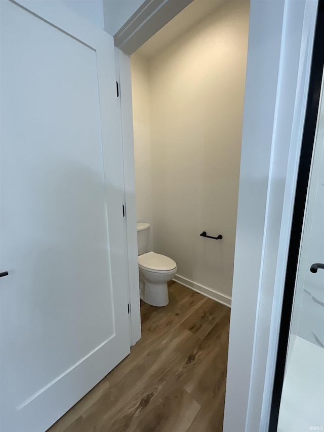 1609 Diane Dr, Ossian, IN 46777 - bathroom with wood finished floors and toilet