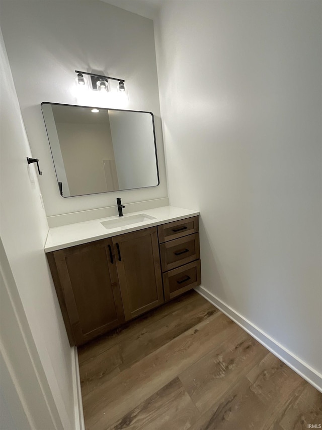 1609 Diane Dr, Ossian, IN 46777 - bathroom with vanity and wood finished floors