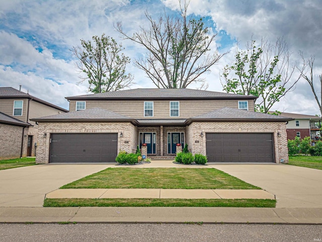 8675 Pebble Creek Dr, Newburgh, IN 47630 - view of front facade with an attached garage, driveway, and brick siding