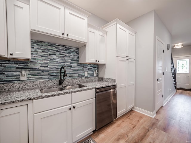 8675 Pebble Creek Dr, Newburgh, IN 47630 - kitchen with dishwashing machine, light wood-style floors, tasteful backsplash, white cabinetry, and light stone countertops