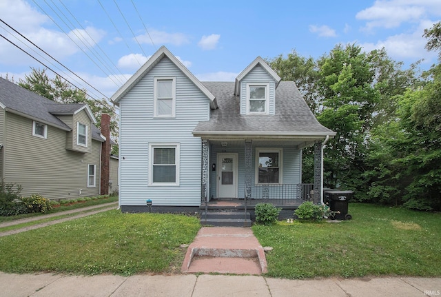 914 Golden Ave, South Bend, IN 46616 - view of front facade featuring a porch, a front yard, and a shingled roof