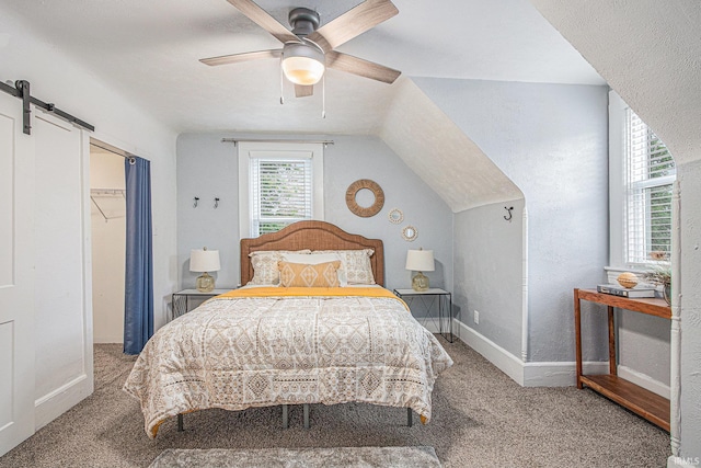 914 Golden Ave, South Bend, IN 46616 - carpeted bedroom with a barn door and ceiling fan