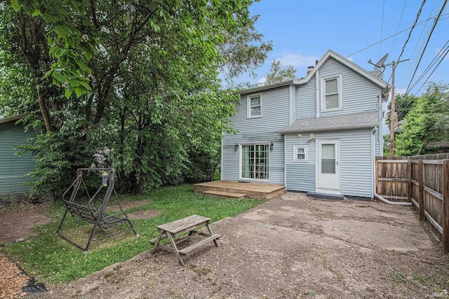 914 Golden Ave, South Bend, IN 46616 - rear view of house featuring a fenced backyard and a chimney
