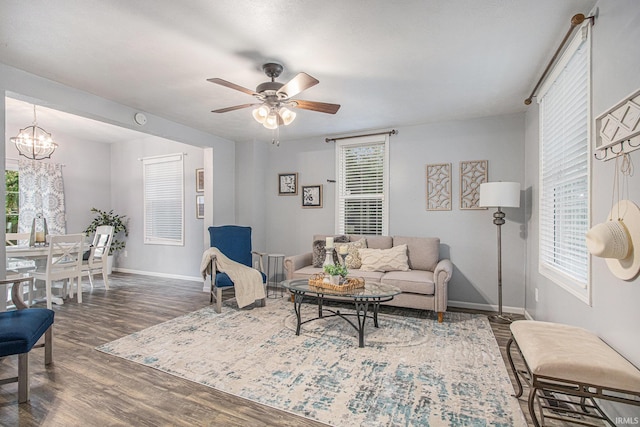 914 Golden Ave, South Bend, IN 46616 - living area with dark wood-type flooring, a ceiling fan, a chandelier, and plenty of natural light