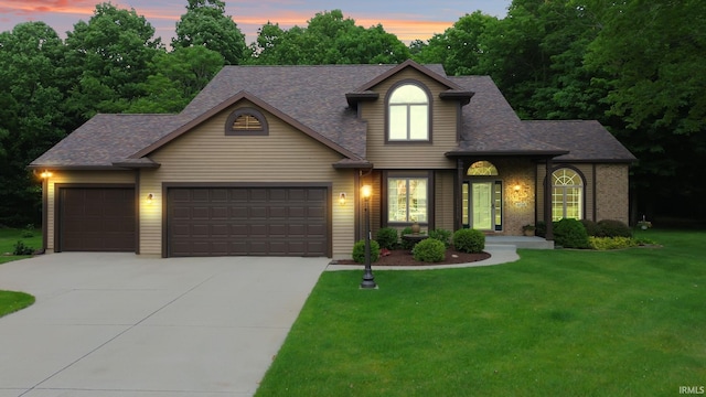 32750 Deer Watch Ct, New Carlisle, IN 46552 - traditional-style house with concrete driveway, an attached garage, a yard, and roof with shingles