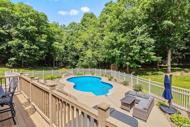 32750 Deer Watch Ct, New Carlisle, IN 46552 - view of swimming pool with a fenced backyard, outdoor lounge area, a wooden deck, and view of wooded area
