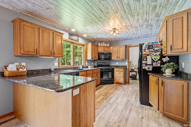 32750 Deer Watch Ct, New Carlisle, IN 46552 - kitchen featuring black appliances, a peninsula, wood ceiling, light wood finished floors, and dark stone countertops