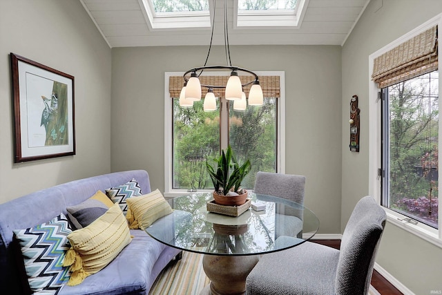2910 E Winston St, Bloomington, IN 47401 - dining space with a skylight, wood finished floors, and lofted ceiling