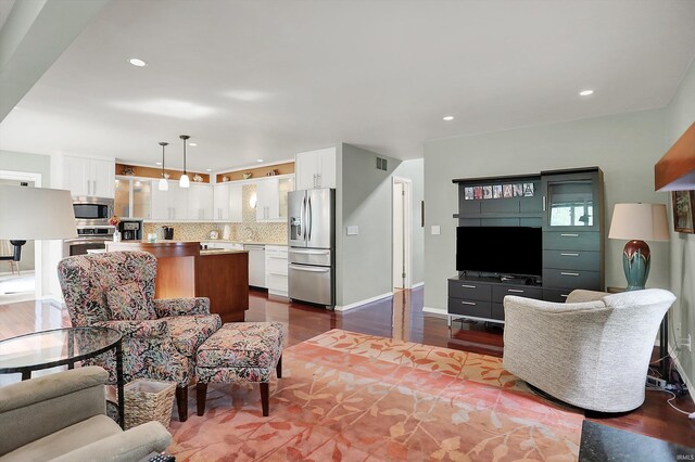 2910 E Winston St, Bloomington, IN 47401 - living room featuring dark wood-style flooring and recessed lighting
