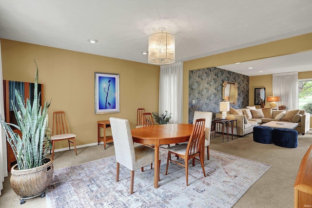 2910 E Winston St, Bloomington, IN 47401 - carpeted dining space with wallpapered walls and an accent wall