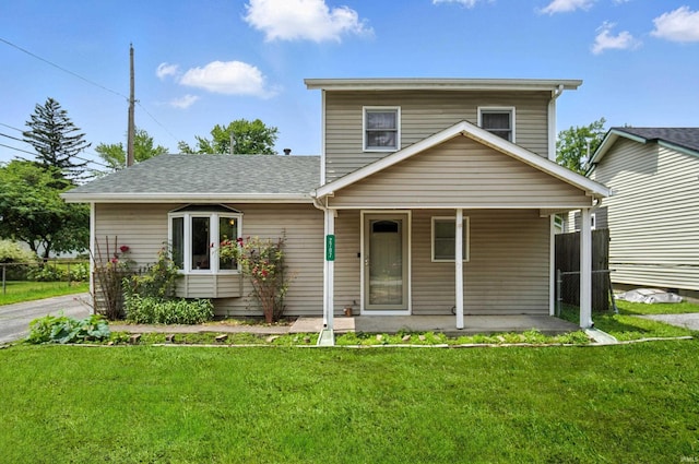 2707 Stanford Ave, Fort Wayne, IN 46808 - view of front of home featuring a porch, a front lawn, and a shingled roof