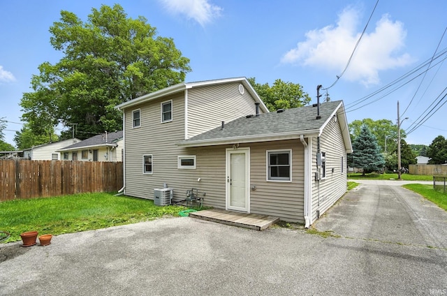 2707 Stanford Ave, Fort Wayne, IN 46808 - back of property featuring a shingled roof and a patio