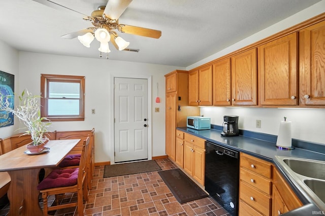 2707 Stanford Ave, Fort Wayne, IN 46808 - kitchen featuring dishwasher, white microwave, brick patterned floors, brown cabinets, and dark countertops