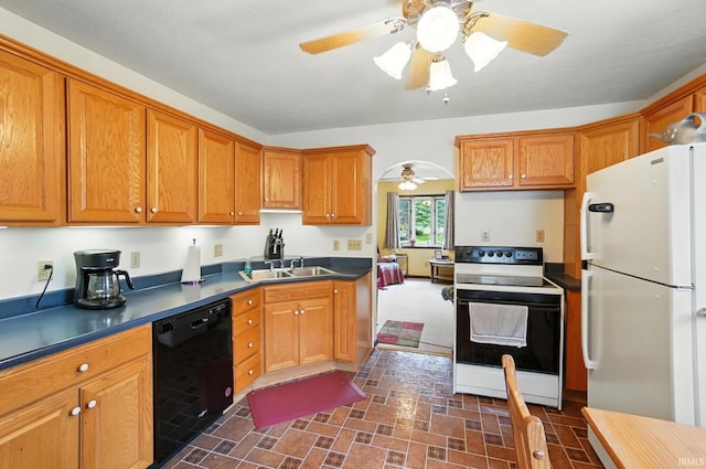 2707 Stanford Ave, Fort Wayne, IN 46808 - kitchen with white appliances, brown cabinets, and dark countertops
