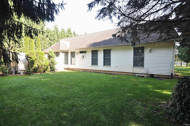 14689 Adams Rd, Granger, IN 46530 - rear view of property featuring a yard and roof with shingles