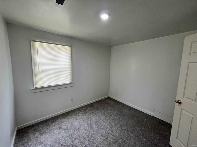 410 N Jay St, Kokomo, IN 46947 - unfurnished room with dark colored carpet and baseboards