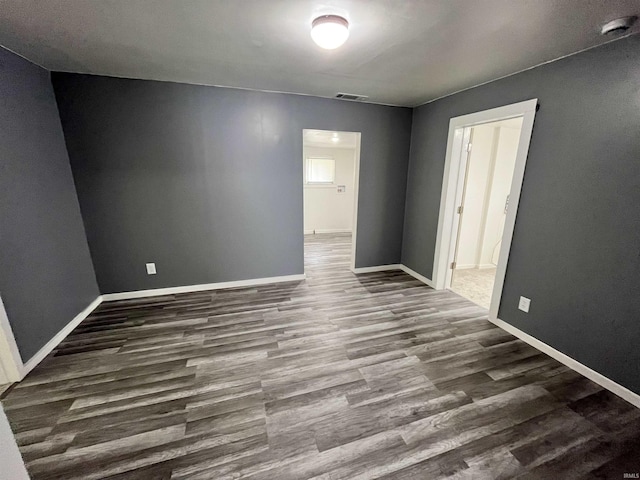 410 N Jay St, Kokomo, IN 46947 - spare room with wood finished floors and a smoke detector