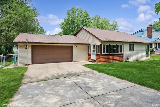 19629 Gilmer St, South Bend, IN 46614 - single story home with an attached garage, a metal roof, driveway, a gate, and entry steps