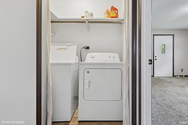19629 Gilmer St, South Bend, IN 46614 - laundry area with washing machine and clothes dryer, a textured ceiling, and carpet floors