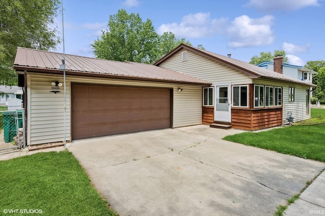 19629 Gilmer St, South Bend, IN 46614 - ranch-style home featuring entry steps, driveway, an attached garage, and a metal roof