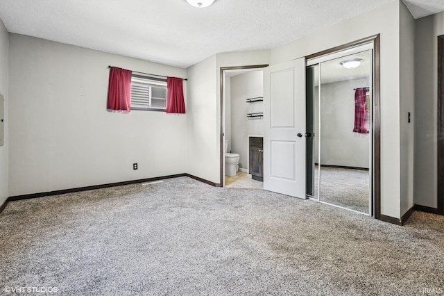 19629 Gilmer St, South Bend, IN 46614 - unfurnished bedroom with carpet floors, a closet, ensuite bath, and a textured ceiling