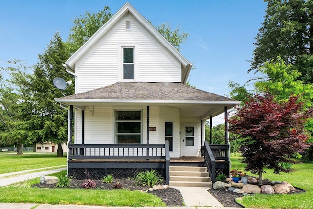 718 N Cedar St, Auburn, IN 46706 - view of front of home with covered porch, a front yard, and a shingled roof