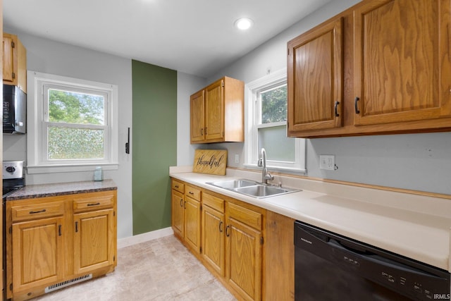 718 N Cedar St, Auburn, IN 46706 - kitchen with black appliances, recessed lighting, light countertops, and brown cabinetry