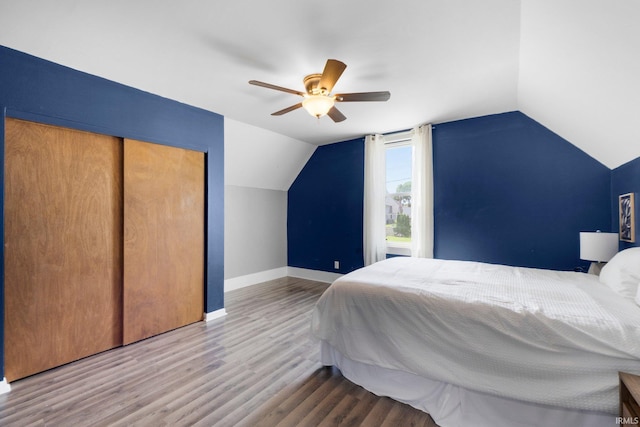 718 N Cedar St, Auburn, IN 46706 - bedroom featuring lofted ceiling, wood finished floors, a closet, and ceiling fan