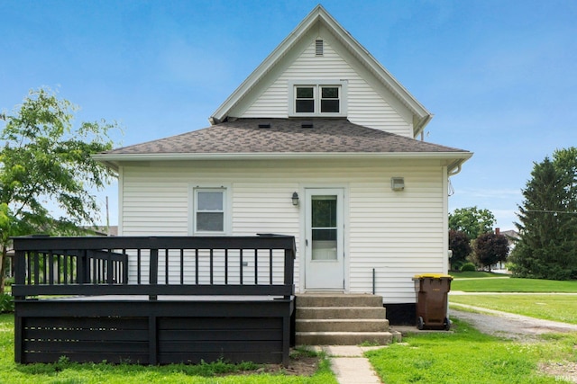 718 N Cedar St, Auburn, IN 46706 - rear view of house featuring a yard, a deck, and a shingled roof