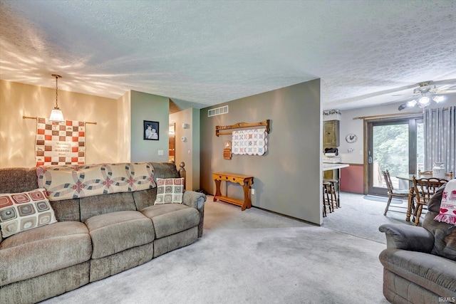 600 Forest Dr, Bloomfield, IN 47424 - living area with a textured ceiling, carpet floors, and a ceiling fan
