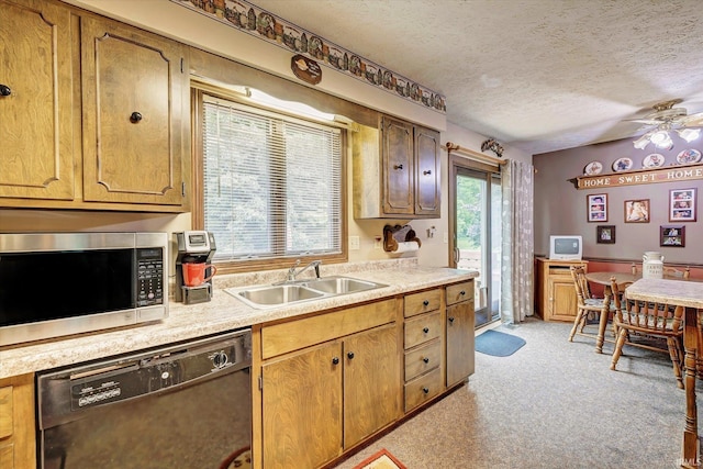 600 Forest Dr, Bloomfield, IN 47424 - kitchen with stainless steel microwave, black dishwasher, light countertops, a textured ceiling, and light colored carpet