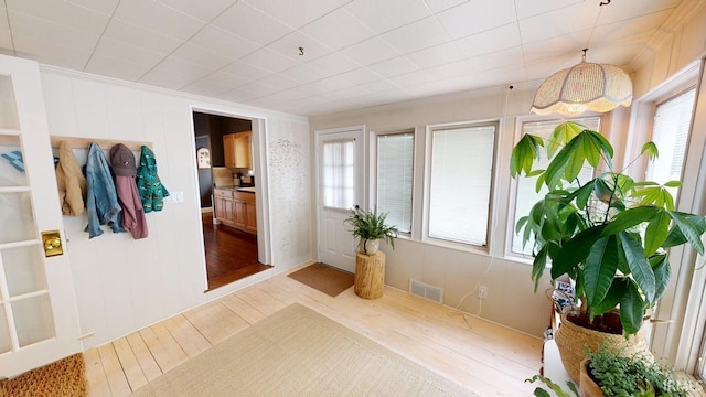 325 W 5th St, Jasper, IN 47546 - corridor with light wood-style floors and ornamental molding