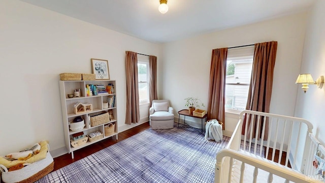 325 W 5th St, Jasper, IN 47546 - bedroom featuring a nursery area and wood finished floors