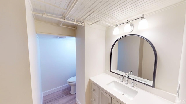 325 W 5th St, Jasper, IN 47546 - half bath featuring vanity and wood finished floors