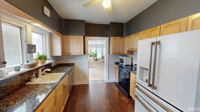 325 W 5th St, Jasper, IN 47546 - kitchen featuring white appliances, light brown cabinets, dark wood-type flooring, ceiling fan, and dark stone counters