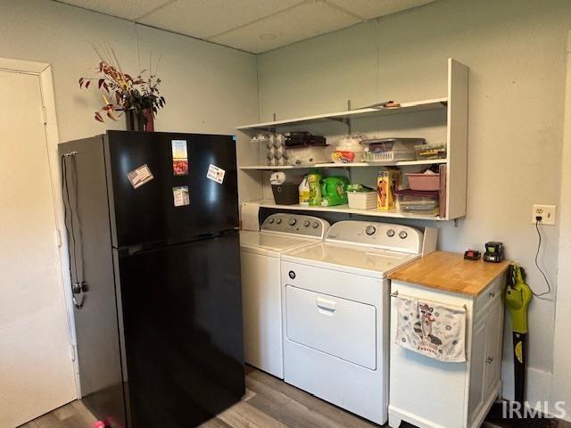 307 N Madison Ave, Fowler, IN 47944 - washroom with washing machine and clothes dryer and wood finished floors