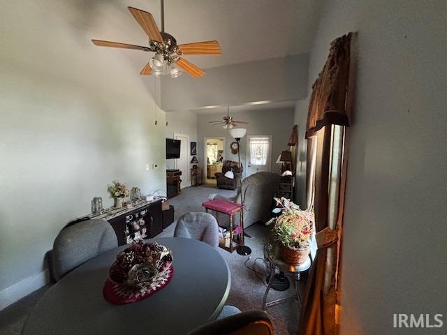 307 N Madison Ave, Fowler, IN 47944 - dining area featuring carpet flooring, ceiling fan, and a high ceiling