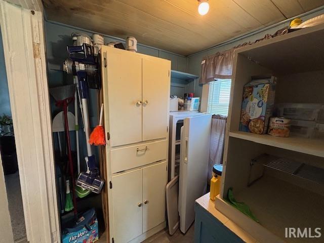 307 N Madison Ave, Fowler, IN 47944 - kitchen with wood ceiling, light countertops, and white cabinetry