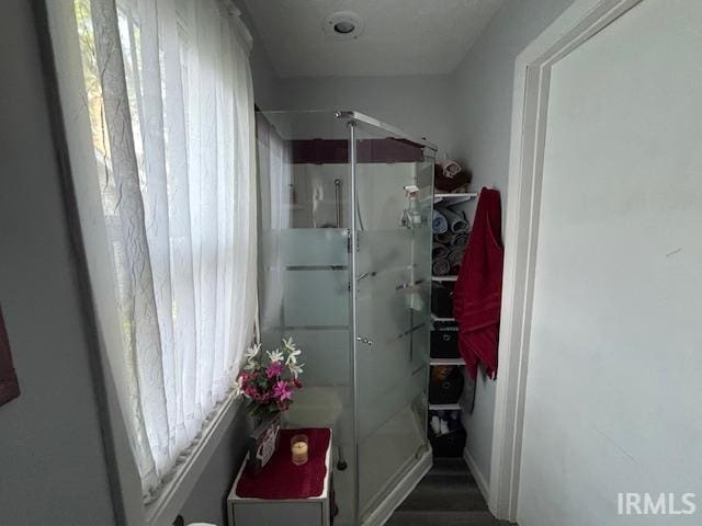307 N Madison Ave, Fowler, IN 47944 - full bathroom featuring a stall shower and wood finished floors