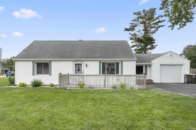 2606 Prairie Grove Dr, Fort Wayne, IN 46809 - view of front of house with an attached garage, asphalt driveway, roof with shingles, and a front lawn
