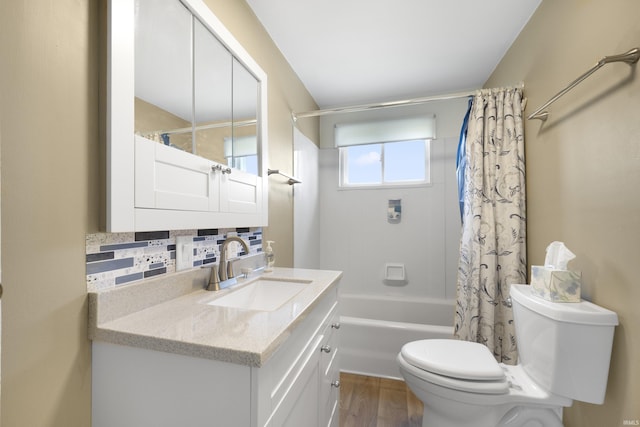 2606 Prairie Grove Dr, Fort Wayne, IN 46809 - full bathroom featuring vanity, shower / tub combo, tasteful backsplash, and wood finished floors