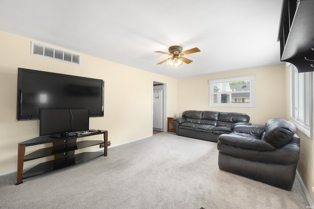 2606 Prairie Grove Dr, Fort Wayne, IN 46809 - carpeted living room with ceiling fan and baseboards