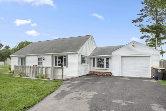 2606 Prairie Grove Dr, Fort Wayne, IN 46809 - view of front facade featuring an attached garage, asphalt driveway, a shingled roof, and a front yard