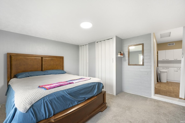 2606 Prairie Grove Dr, Fort Wayne, IN 46809 - bedroom featuring light colored carpet, attic access, and ensuite bathroom