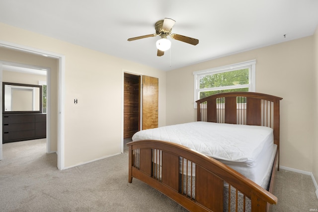2606 Prairie Grove Dr, Fort Wayne, IN 46809 - bedroom featuring light colored carpet, a closet, and a ceiling fan
