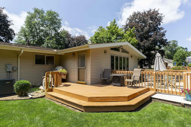 12069 N Timberline Trce, Granger, IN 46530 - wooden deck with an outdoor fire pit and a lawn